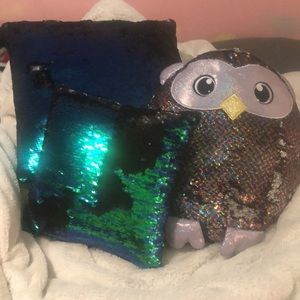 A large sequin pillow, a mini sequin pillow, and a sequin owl